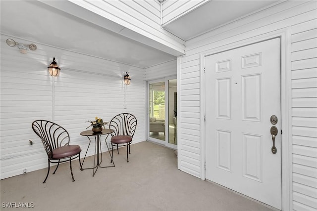 sitting room featuring concrete floors