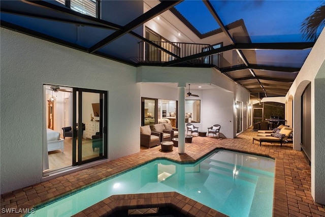 view of pool featuring a jacuzzi and ceiling fan