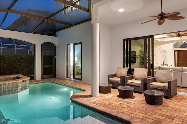 view of pool featuring an in ground hot tub and ceiling fan