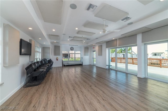 living room with wood-type flooring and ceiling fan