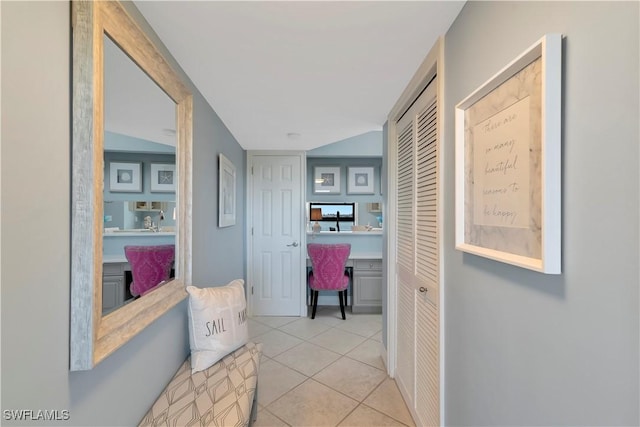 corridor featuring light tile patterned floors