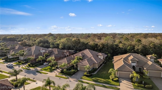 6589 Roma Way, Naples, FL 34113 - aerial view of residential area with a forest