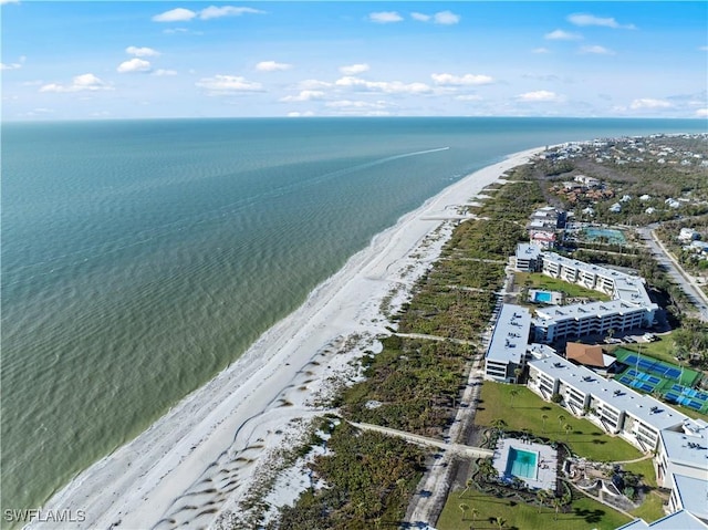 bird's eye view with a water view and a view of the beach