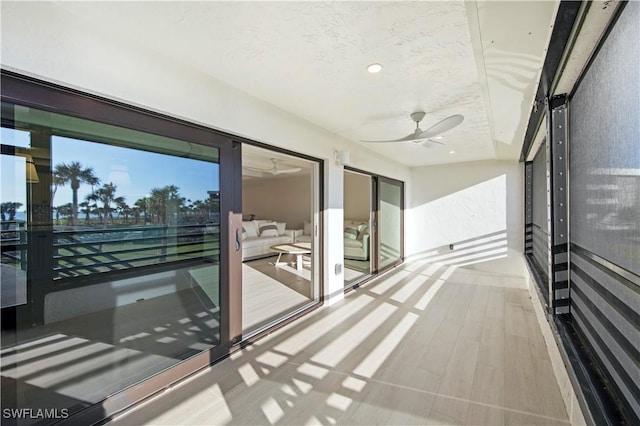 interior space featuring a textured ceiling and light hardwood / wood-style floors