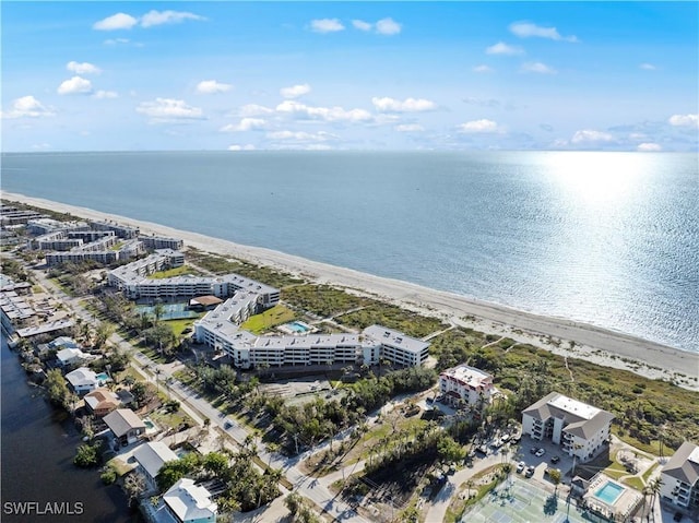 bird's eye view featuring a water view and a view of the beach