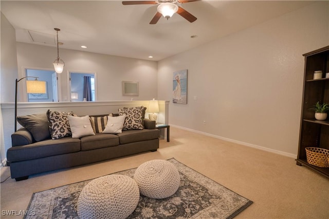 carpeted living room with ceiling fan