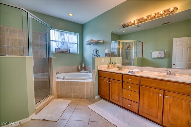 bathroom featuring tile patterned floors, vanity, and independent shower and bath