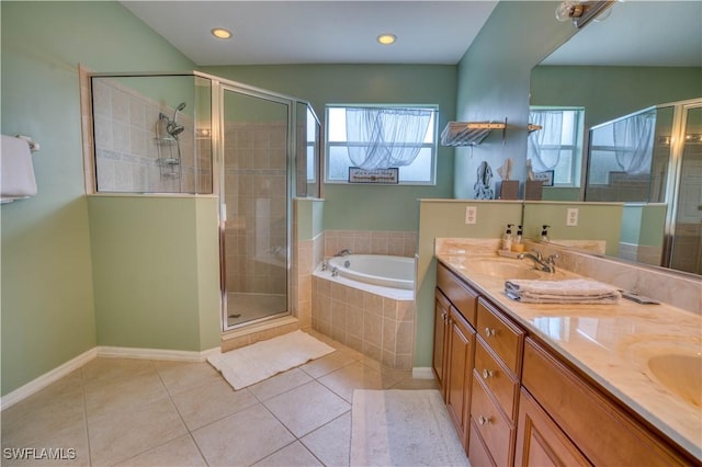 bathroom featuring shower with separate bathtub, vanity, and tile patterned floors