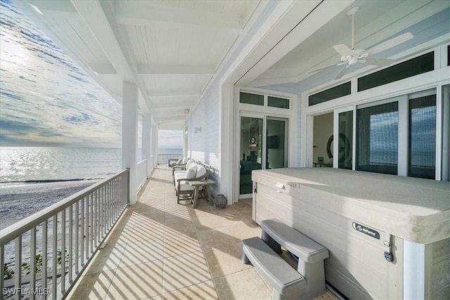 view of patio / terrace with a balcony and ceiling fan