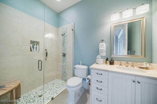 bathroom featuring vanity, toilet, and walk in shower