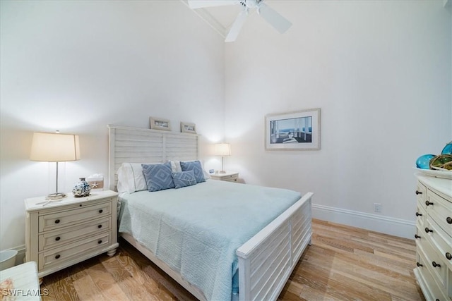 bedroom with ceiling fan and light hardwood / wood-style floors