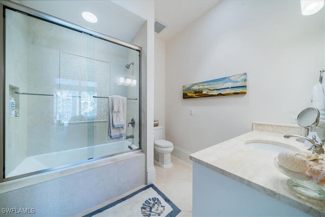 full bathroom with enclosed tub / shower combo, vanity, tile patterned floors, and toilet