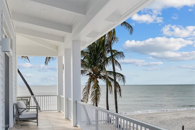 exterior space with a beach view and a water view