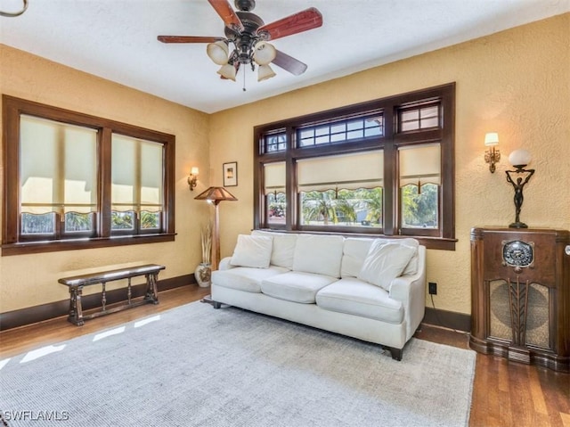 1249 Osceola Dr, Fort Myers, FL 33901 - living area featuring plenty of natural light, baseboards, wood finished floors, and a textured wall
