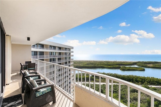 balcony featuring a water view