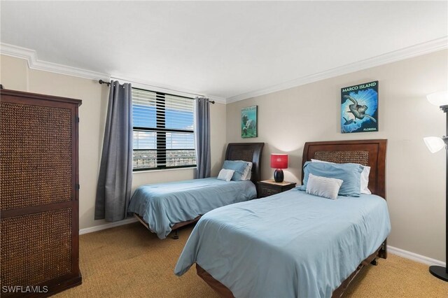 bedroom with crown molding and light colored carpet