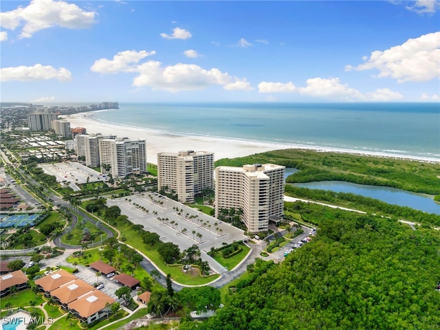 birds eye view of property with a beach view and a water view