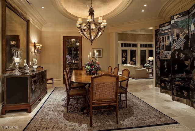 dining room with a raised ceiling, crown molding, french doors, and a notable chandelier