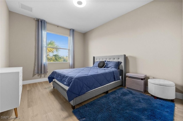 bedroom with light hardwood / wood-style flooring