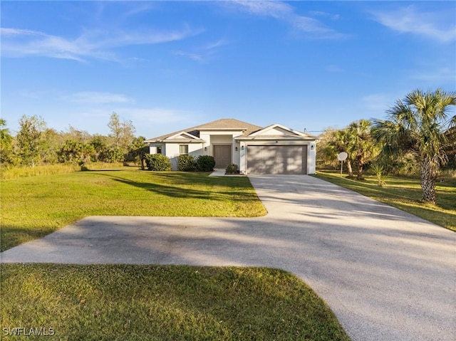 view of front of property with a garage and a front yard