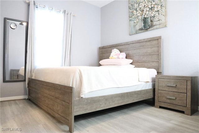 bedroom featuring light hardwood / wood-style floors