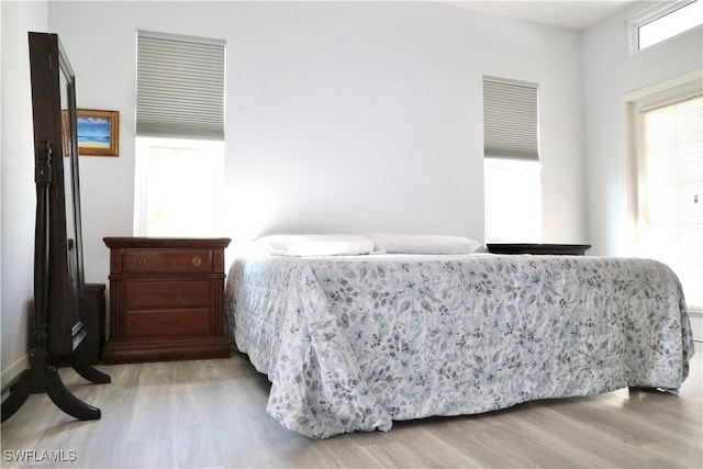 bedroom with light wood-type flooring