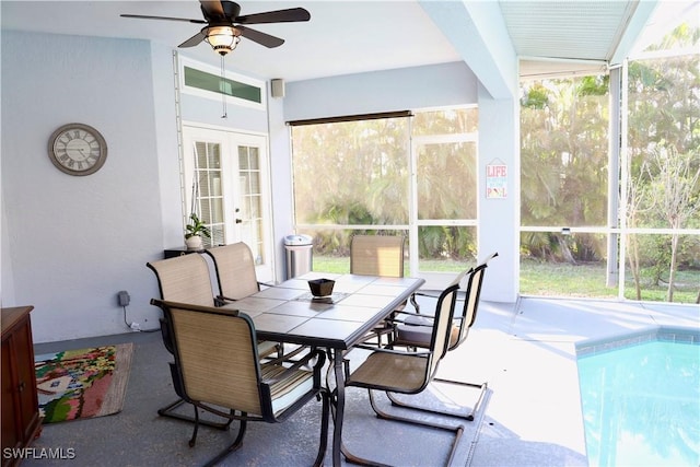 sunroom with ceiling fan and french doors