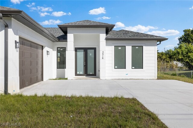 exterior space with a lawn and a garage