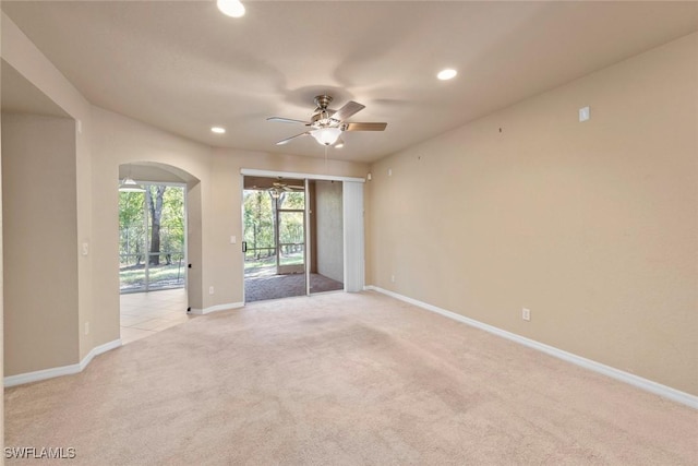 carpeted empty room with ceiling fan