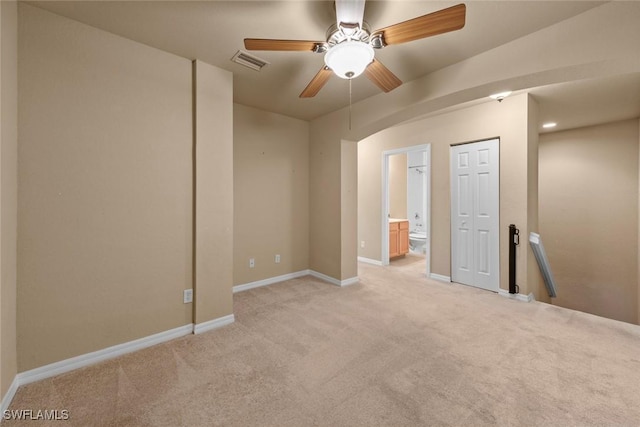 unfurnished room with light carpet and ceiling fan