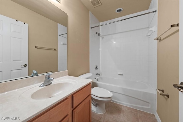 full bathroom featuring tile patterned floors, vanity, bathtub / shower combination, and toilet