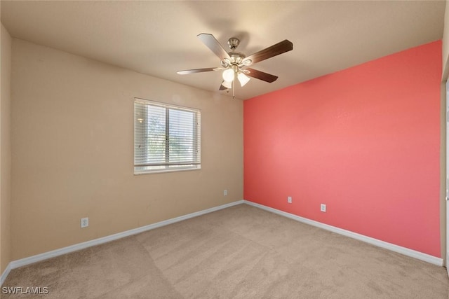 unfurnished room with light carpet and ceiling fan