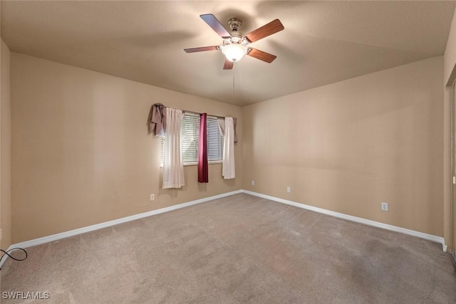 carpeted empty room with ceiling fan