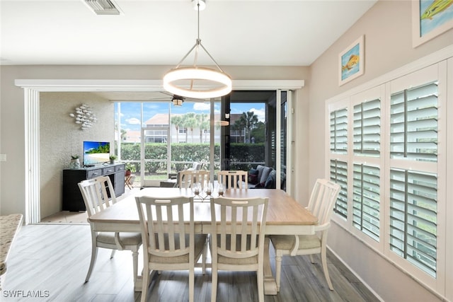 dining room with hardwood / wood-style flooring