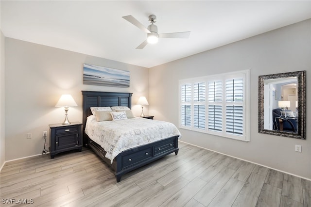 bedroom with ceiling fan and light hardwood / wood-style flooring