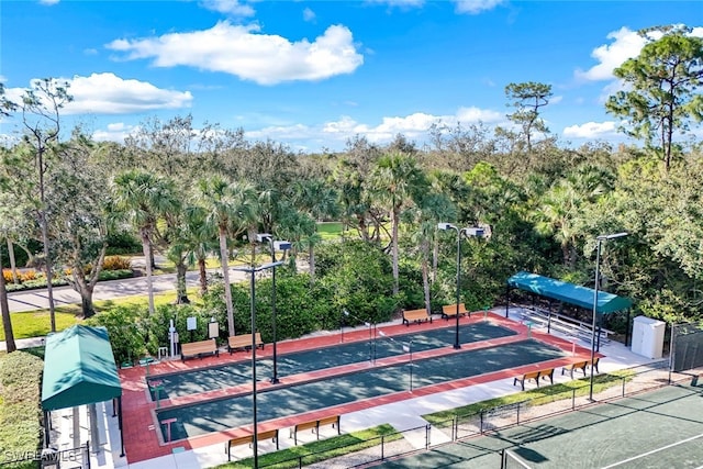 view of tennis court with fence