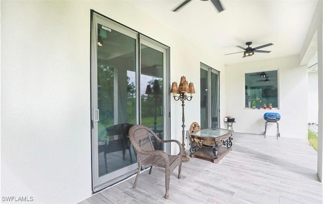 wooden deck featuring ceiling fan