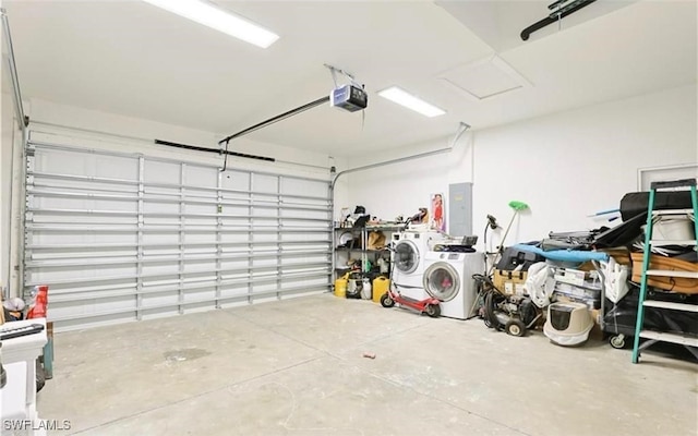 garage featuring a garage door opener and washer and clothes dryer