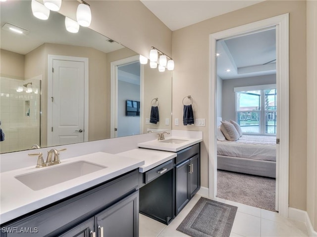 bathroom featuring tile patterned flooring, vanity, and an enclosed shower