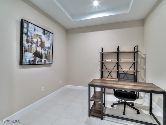 tiled home office with a raised ceiling