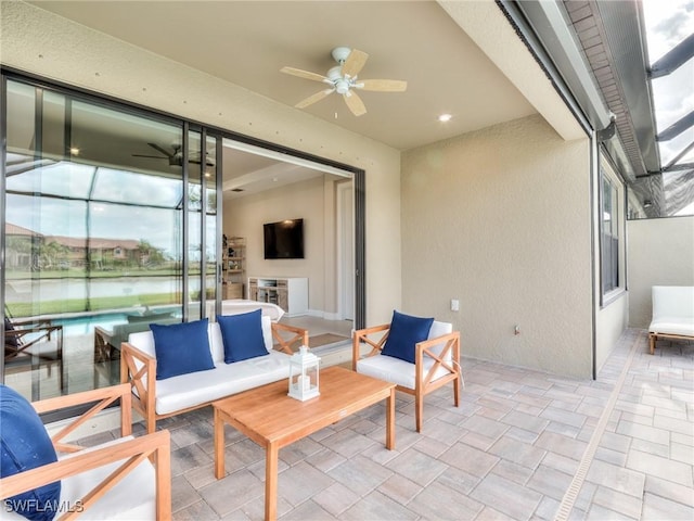 view of patio / terrace featuring an outdoor hangout area, ceiling fan, and a lanai