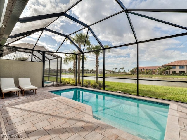 view of pool with a lanai, a water view, and a patio