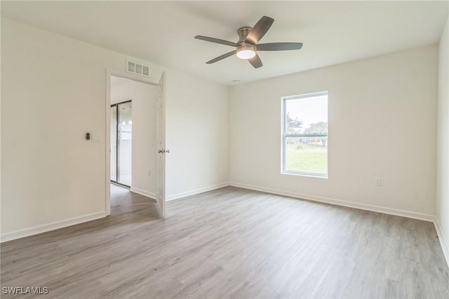 spare room with ceiling fan and light hardwood / wood-style floors