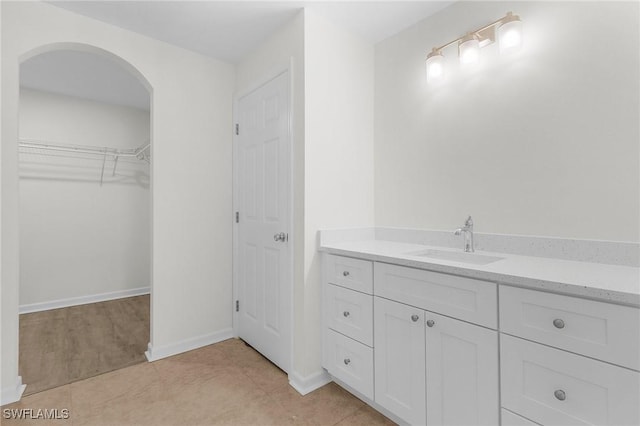 bathroom featuring tile patterned floors and vanity