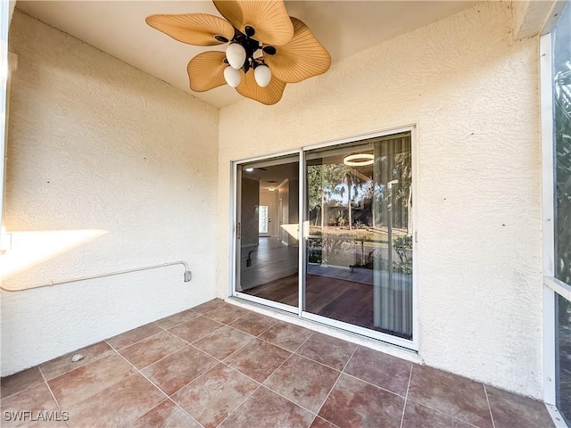 exterior space featuring ceiling fan