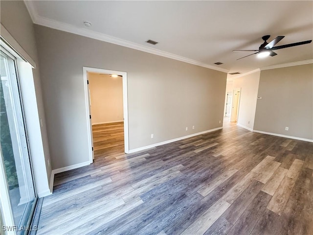 empty room featuring ceiling fan, wood-type flooring, and crown molding