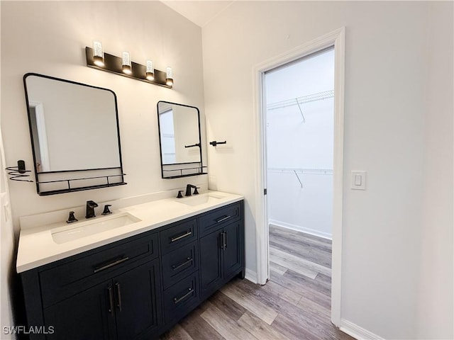 bathroom with vanity and hardwood / wood-style flooring