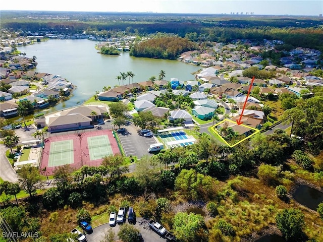 birds eye view of property featuring a water view