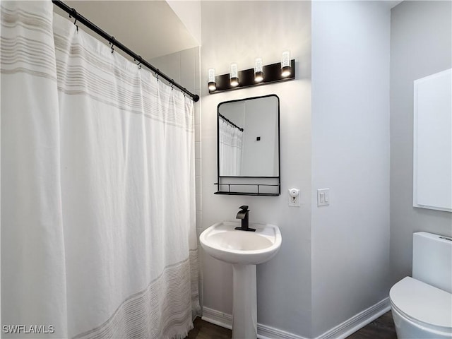 bathroom featuring sink and toilet