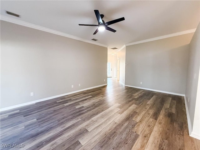 empty room featuring dark hardwood / wood-style floors, ceiling fan, and ornamental molding